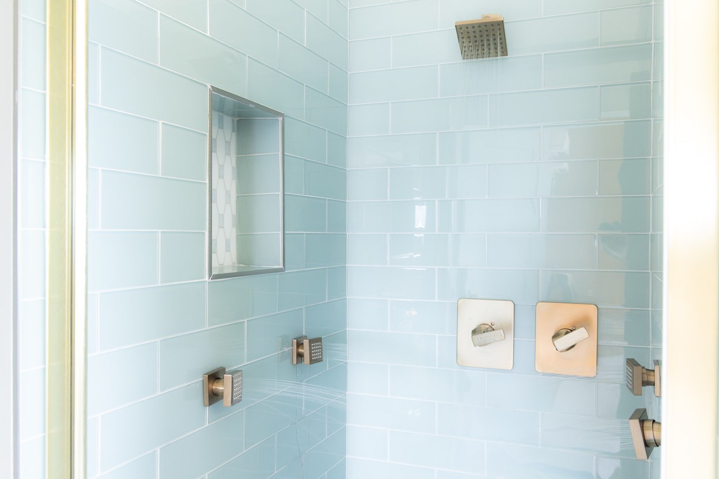 Second bathroom with blue tile shower and dual heads