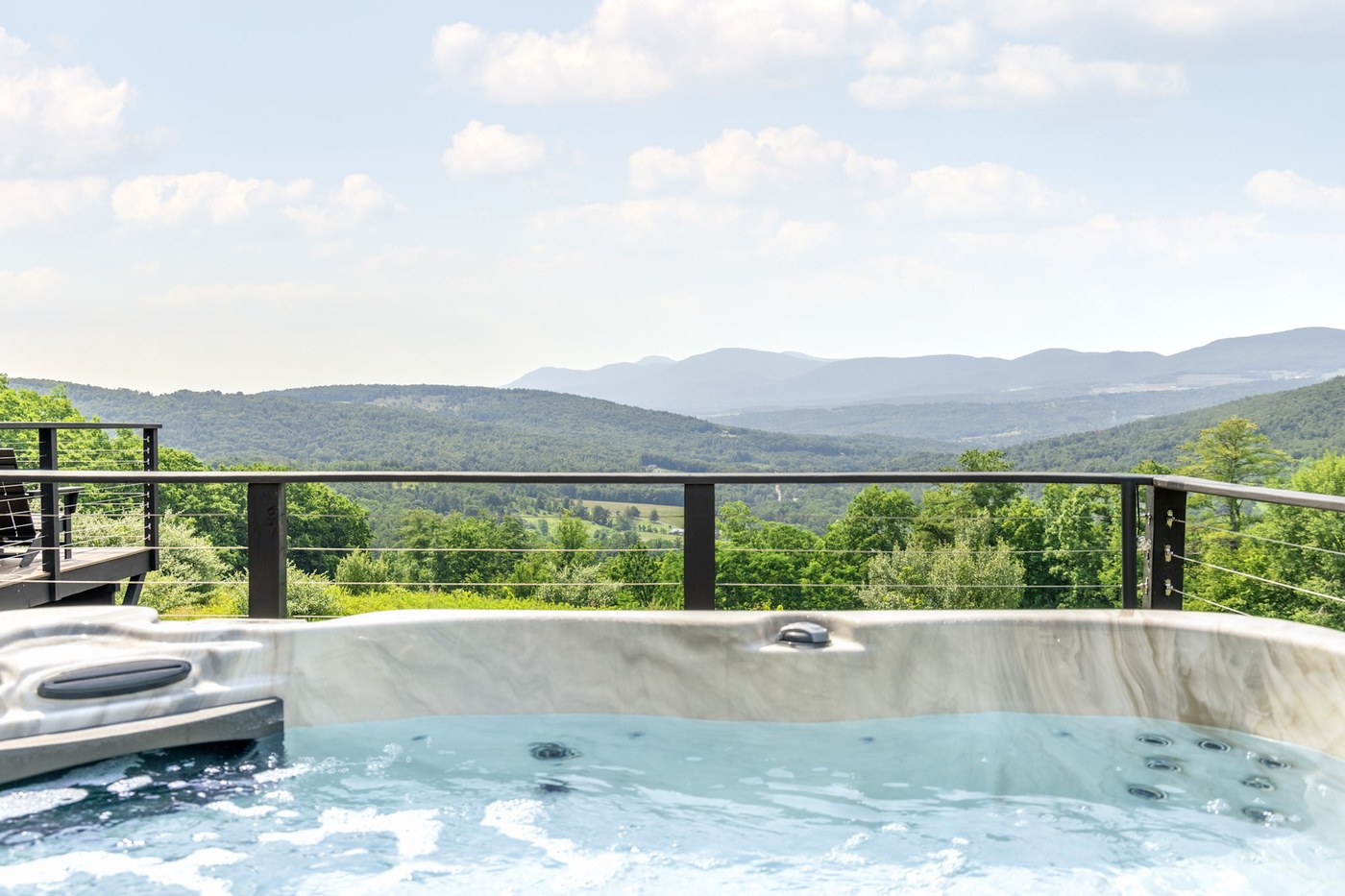 Hollow Sky hot tub overlooking the Catskills at night