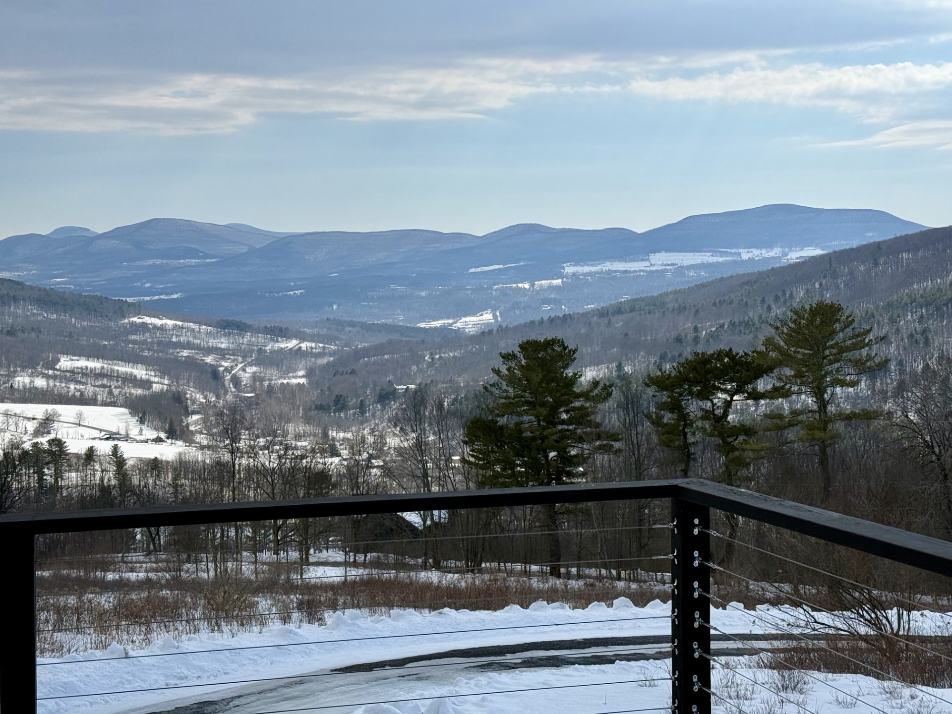 Snow-covered fields and Catskill mountain views at Hollow Sky in winter